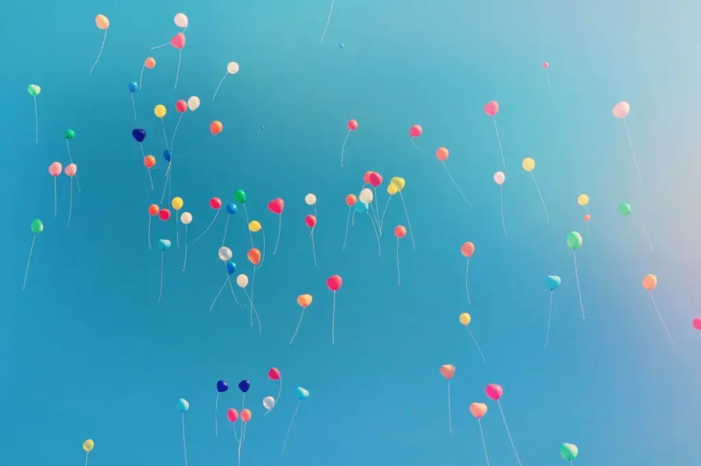 assorted colored balloons mid airs
