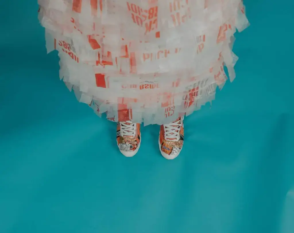 person wearing brown-and-white lace-up shoes