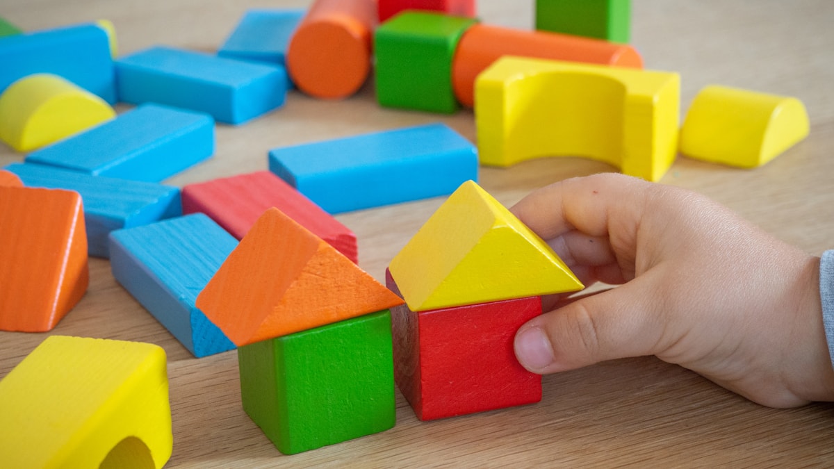 Colourful building blocks being put together