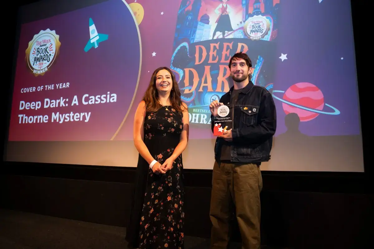 The Deep Dark: A Cassia Thorne Mystery team collecting Children’s Book Cover of the Year at The Week Junior Book Awards 2026